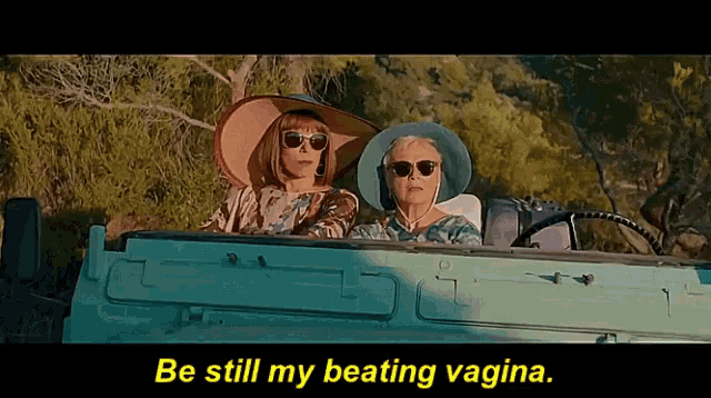 two women are sitting in a car with the words be still my beating vagina