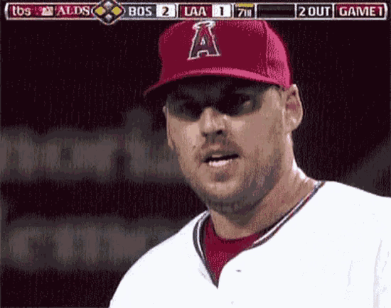 a baseball player wearing a red hat with the letter a on the front