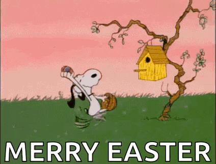 snoopy is holding an easter egg in his hand while standing next to a bird house .