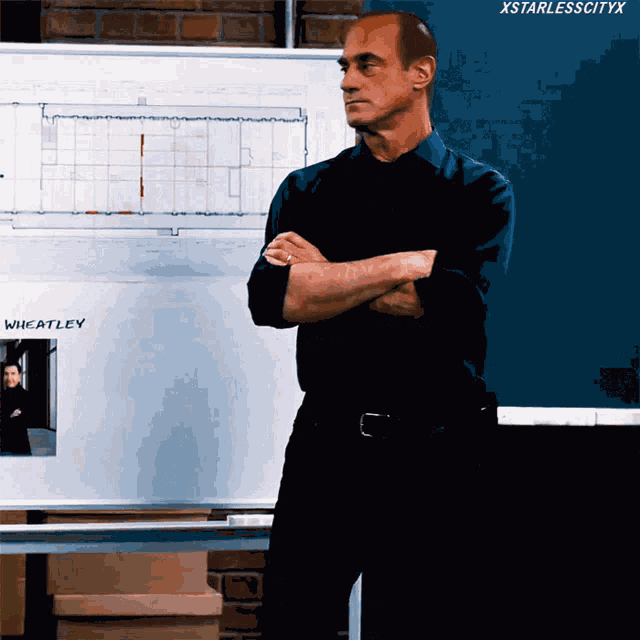 a man is standing in front of a white board that says wheatley