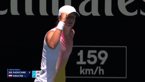 a woman in a white hat stands in front of a sign that says 2 break points
