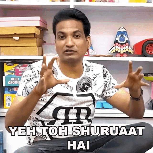 a man wearing a shirt that says yeh toh shuruaat hai on it