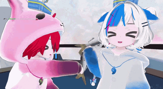 a girl in a cat costume holds a fish next to a girl in a white and blue outfit