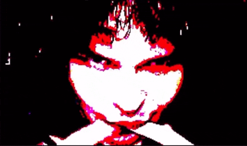 a pixelated image of a person 's face with red eyes and a crown .