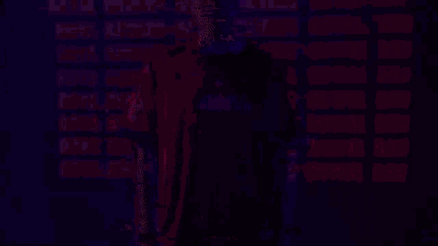 a man in a red royal ravens shirt