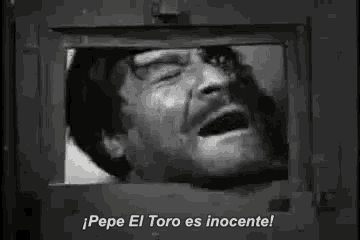 a man is laughing in a black and white photo with the words pepe el toro es inocente .