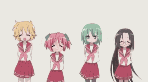 a group of anime girls are standing next to each other in a line .