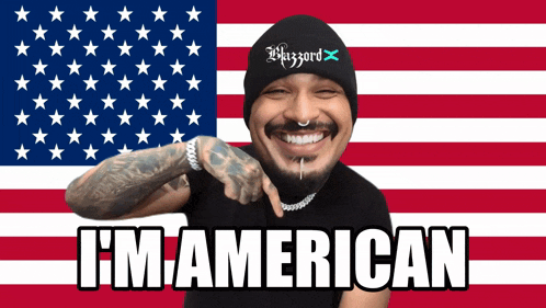 a man in front of an american flag with the words i 'm american below him