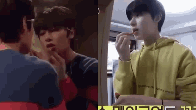 a man is brushing his teeth in front of a mirror and another man is eating something .