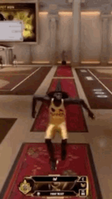 a man in a wizard hat is jumping in a basketball court
