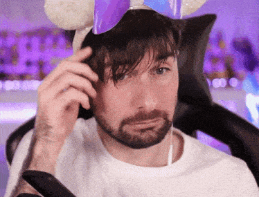 a man with a beard wearing a headband with ears
