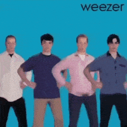 a group of men standing next to each other with their hands on their hips on a blue background .