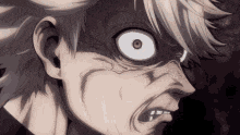 a close up of a person 's face with a very angry expression .