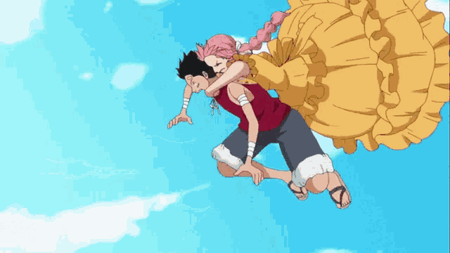 a man is carrying a woman in a yellow dress in the air