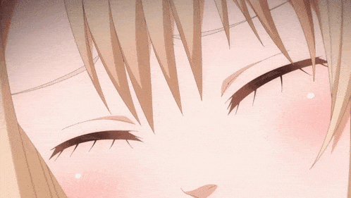 a close up of a girl 's face with her eyes closed and her mouth closed