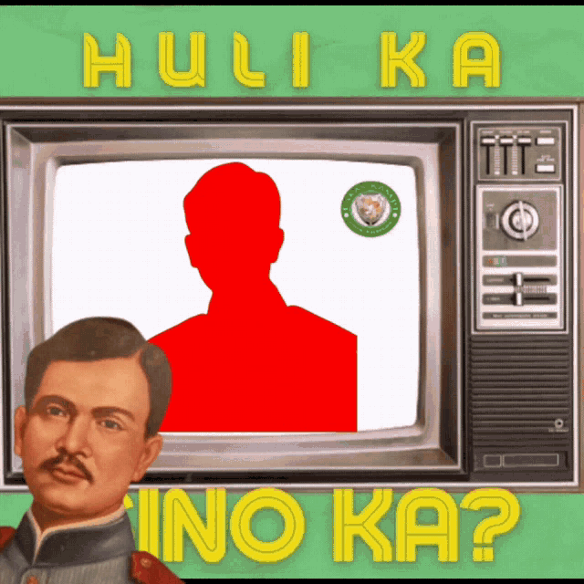 a man with a mustache is standing in front of a television with the words " hulika ino ka " on the bottom