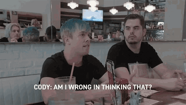 two men are sitting at a diner and one of them is asking the other if he is wrong in thinking that