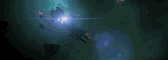 a dark background with a glowing light in the middle of it