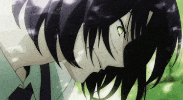 a close up of a person 's face with a green eye