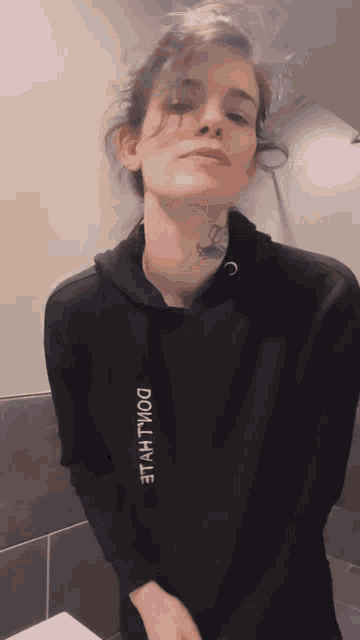 a woman is wearing a black hoodie that says " do n't lie "