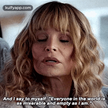 a close up of a woman 's face with her eyes closed and a quote on her face .