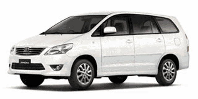 a white toyota minivan is on a white background .