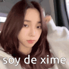 a close up of a woman 's face with the words soy de xime written above her .