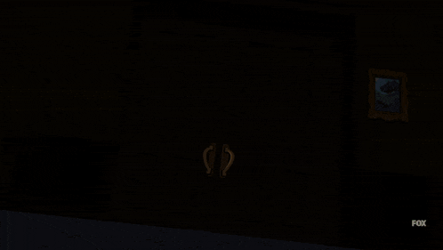 lois griffin from family guy is standing in a doorway with her arms outstretched
