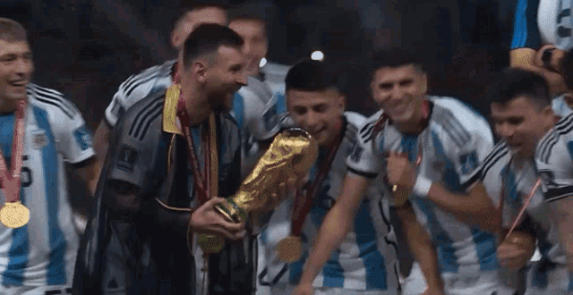 a group of soccer players with medals around their necks including one with the number 19