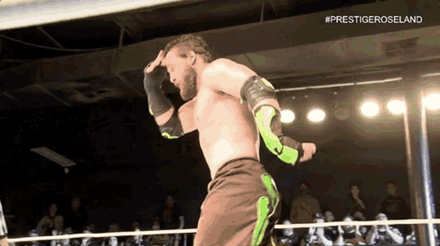 a man in a wrestling ring with the hashtag #prestigeroseland