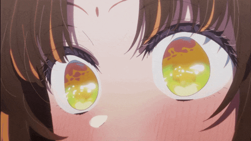 a close up of a girl 's eyes with a red and yellow reflection