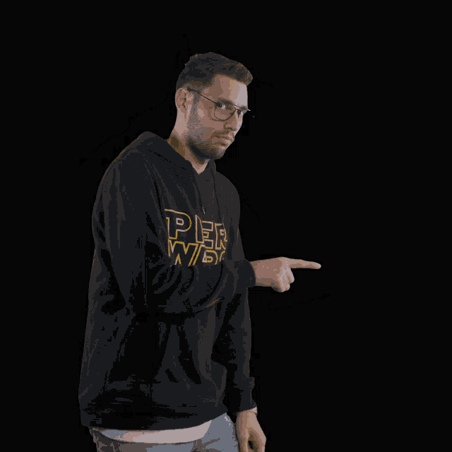 a man wearing a black pier wars hoodie is dancing