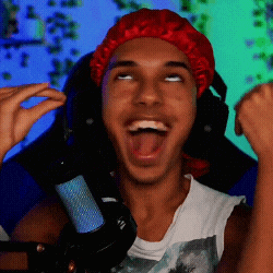 a young man wearing a red hat and headphones is making a funny face