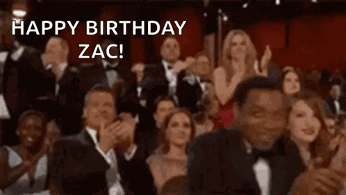 a crowd of people applauding at an awards ceremony with the words `` happy birthday zac '' written on the bottom .
