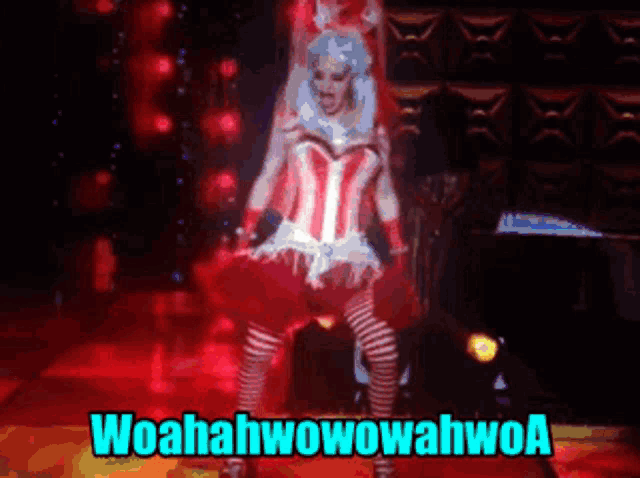 a woman in a corset and striped stockings is dancing with the words woahahwowowahwoa behind her