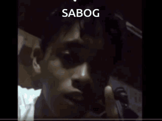 a close up of a man 's face with the word sabog written above him