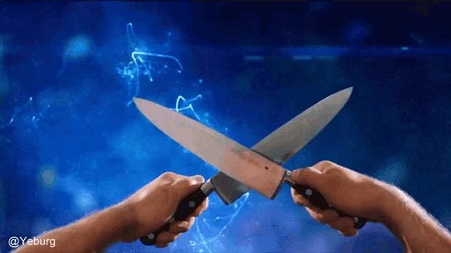a person is holding two knives crossed in front of a blue background with a watermark that says @yeburg
