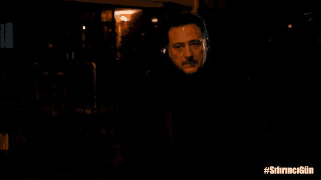 a man in a dark room with the hashtag #sfirncigun on the bottom right