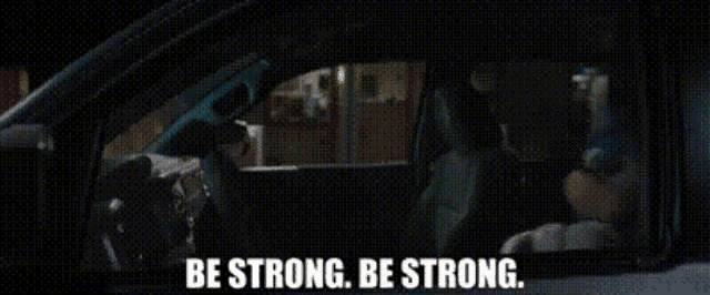 sonic the hedgehog is sitting in the driver 's seat of a car and says be strong be strong