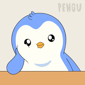 a blue and white penguin sitting on a table with the word pengu in the corner