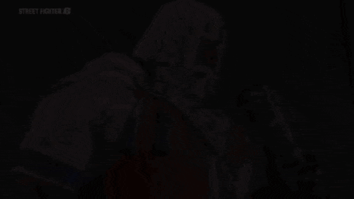 a pixelated image of a man laying on the floor with the words street fighter on the bottom