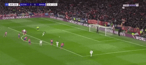 a soccer game is being played in front of a qatar airways ad
