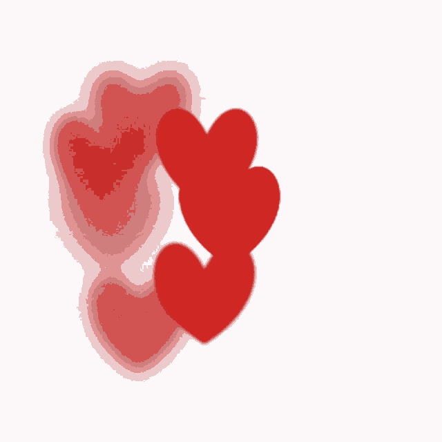three red hearts on a white background