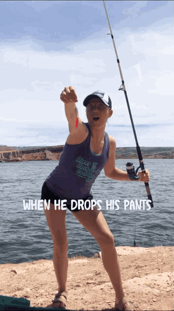a woman holding a fishing rod with the words when he drops his pants written below her