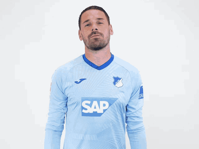 a man wearing a blue shirt that says sa