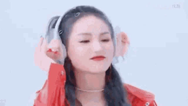 a close up of a woman wearing headphones .