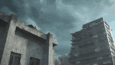 a person standing on the roof of a building with a stormy sky in the background