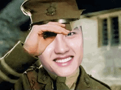 a man in a military uniform is looking through binoculars with his hand .