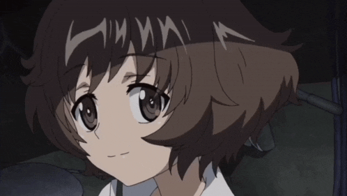 a close up of a girl 's face with brown hair