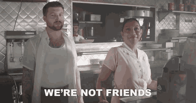 a man and a woman standing in a diner with the words we 're not friends